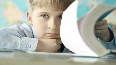A tired elementary school student in class. Stock Footage 74426213