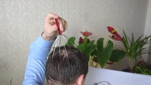 Tired of embroidering man doing massage to himself Stock Footage 130401063