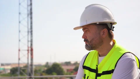 Tired Engineer Take A Break after test the Communications Tower on rooftop Stock Footage 262160947