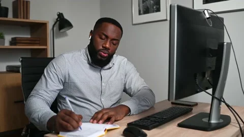 Tired entrepreneur using PC for works at home Stock Footage 145988369