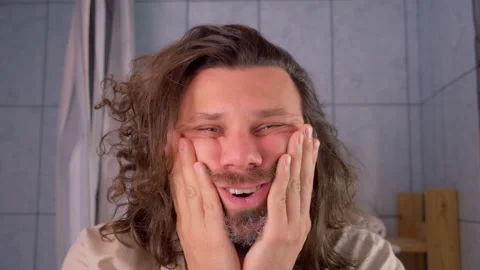 Tired exhausted long haired man touching face expressing different emotions. Stock Footage 312099439