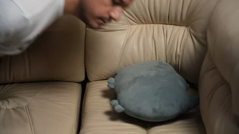 Tired exhausted millennial man falling down on sofa at home after hard working Stock Footage 169454709