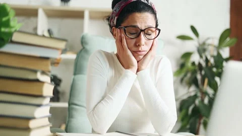 Tired exhausted stressed young hispanic woman student Stock Footage 237749129