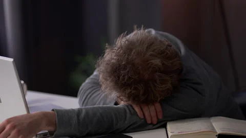 Tired exhausted young man working late at night in office Workaholic, business Stock Footage 160968245