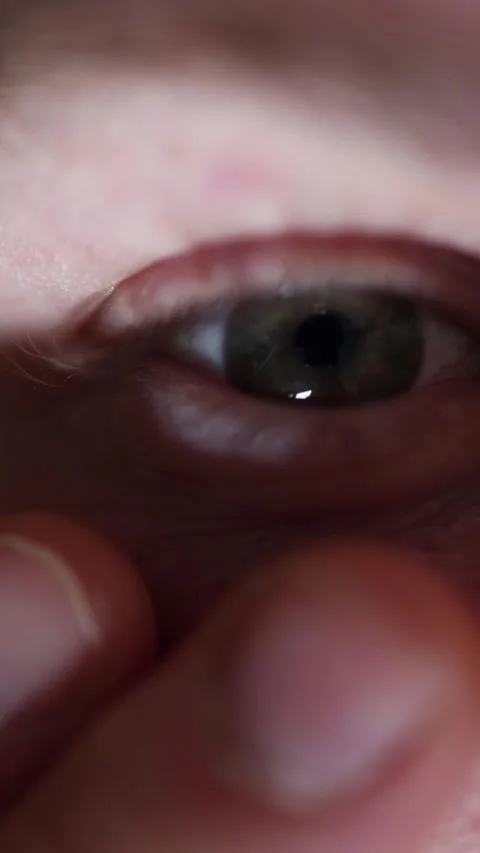 Tired eye seen in mirror reflection Stock Footage 329755393
