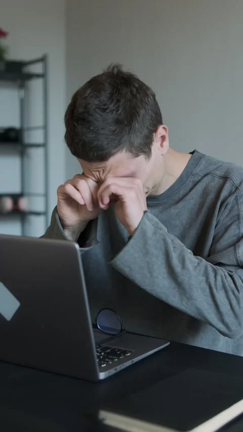Tired eyes from long screen time. Freelancer blinking and massaging eyes. Video stock 308237630