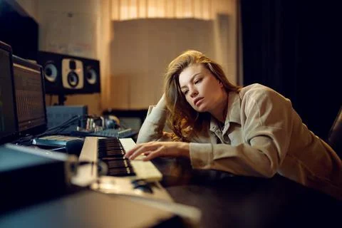 Tired female sound engineer, hard creative process Stock Photos
