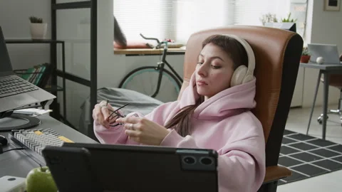 Tired Female Web Developer Reclining in Chair while Working on Code in Office Stock Footage 335936094