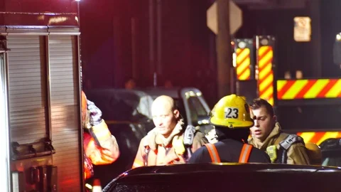 Tired firemen debriefing Stockbeeldmateriaal 116709806