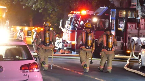 Tired firemen walking Stock Footage 115931754
