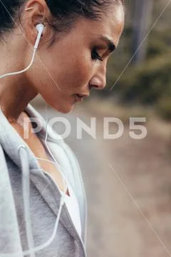 Tired fitness female resting after exercising Stock Photos