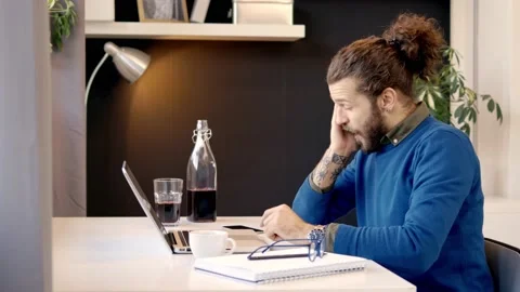 Tired freelancer using laptop. Stock Footage 141378556