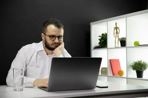 Tired freelancer working at computer in home office, Emotional, physical burnout Stock Photos