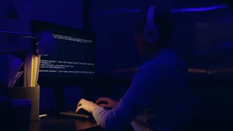 Tired frustrated business executive programmer is working late at night in the Stock Footage 104818088