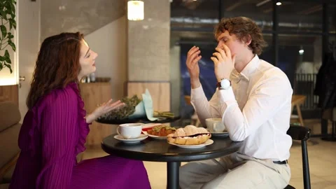 Tired guy losing energy on another date Stock Footage 328285015