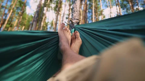 A tired guy resting in the open air in the wood Stock Footage 211877088