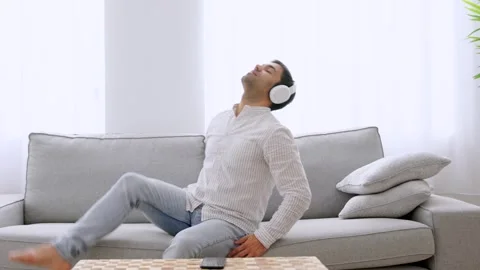 Tired hispanic man relaxing on sofa. Stock Footage 263597867