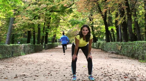 Tired jogger looking to the camera, slow motion shot, steadycam shot Stock-Footage 43746630
