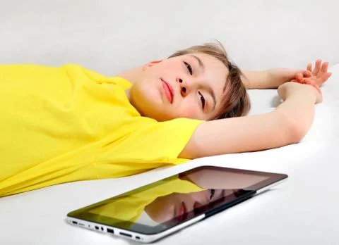 Tired Kid and Tablet Computer Foto stock