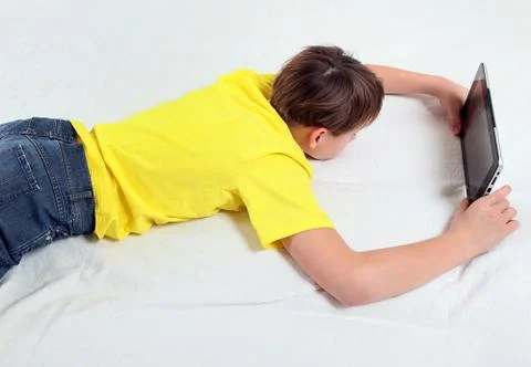 Tired Kid with Tablet Computer Stock Photos