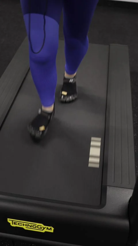 Tired legs keep running on treadmill during long workout Stock-Footage 328253776