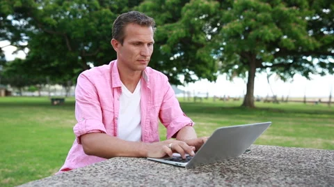 Tired Man With Computer Having Headache At The Park Stock Footage 55620041