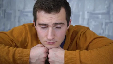 Tired man looking at the camera Stock Footage 146310826