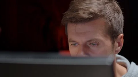 Tired man looking at computer screen at night Stock Footage 317000514