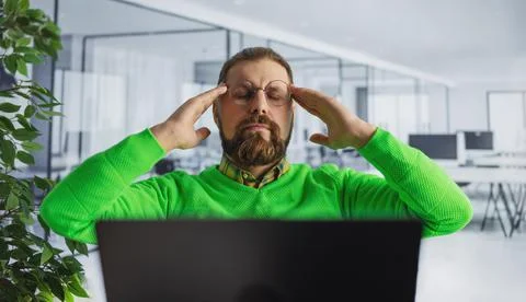 Tired man at office Stock Photos