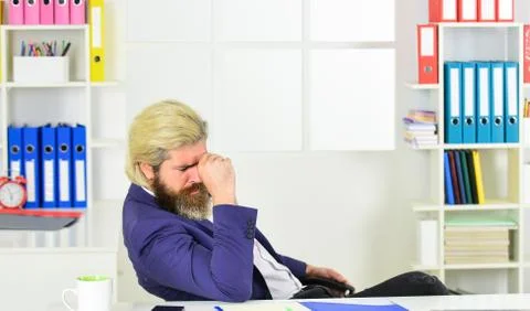 Tired man at office table with folder. business intelligence analyst. enterprise 스톡 사진