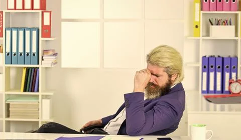 Tired man at office table with folder. business intelligence analyst. enterprise 스톡 사진