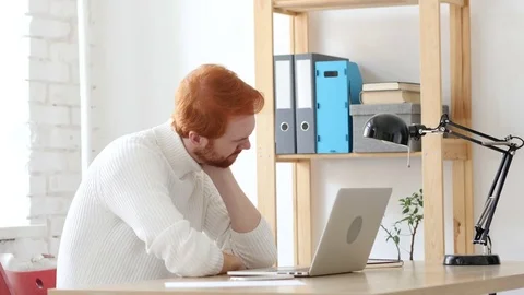 Tired Man with Red Hairs at Work, Trying to Relax Stock Footage