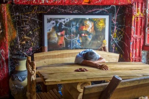 A tired man resting after his work in a public pub in old Havana Stock Photos