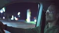 The tired man sits in the car and takes off protective glasses 4k or 4k+ Resolution