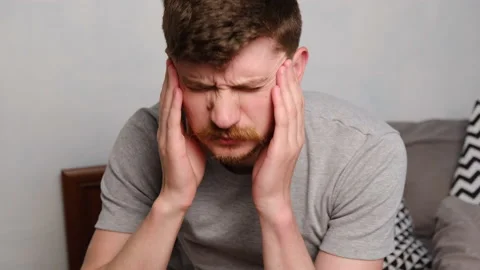 Tired man sitting in bed, thinking of problem, fears, worries and hopeless. Stock Footage 130640823