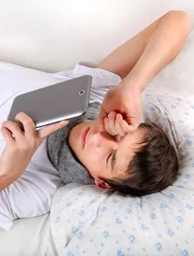 Tired Man with a Tablet Foto stock