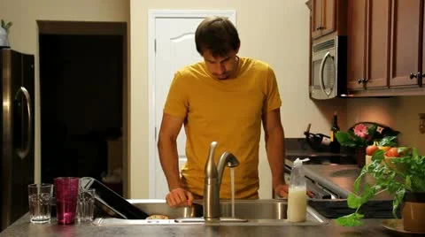 Tired Man Washes Dishes Stock Footage 11608601