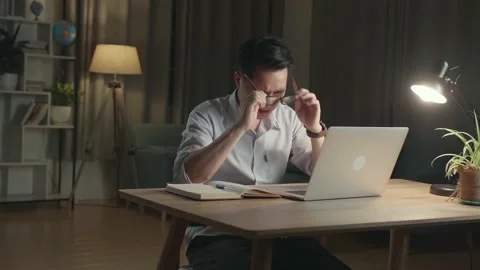 Tired Man While Working From Home At Living Room At Night Stock Footage 154917380