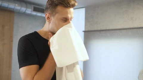 Tired man wiping his face after training in sport club Stock Footage 120405953