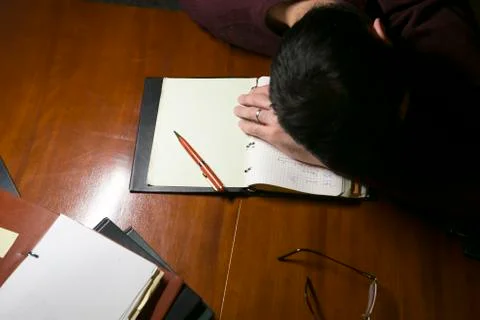 Tired man at work Stock Photos