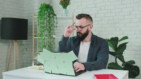 Tired man from working on the computer, takes off glasses to rest his eyes. Stock Footage 156329813