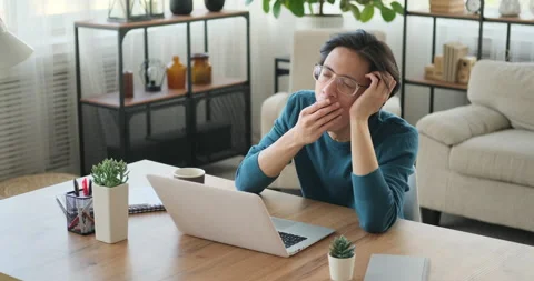 Tired man working on laptop Stock Footage 145292953