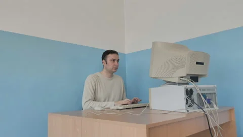Tired Man Working At Old Retro Computer In The Office Stock Footage 126095257