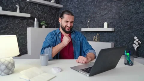 Tired man yawning working doing research on modern laptop tired sitting Video stock 236588139