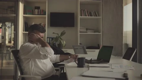 Tired manager alone in the office, working overtime. Stock Footage 201625859