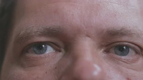 Tired man's eyes close up 動画素材 196319356