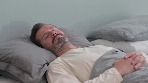 Tired Middle Aged Man Sleeping in Bed Stock Footage 287899196