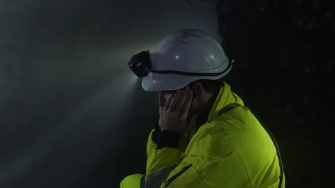 A tired miner drinks water Stock Footage 121182330