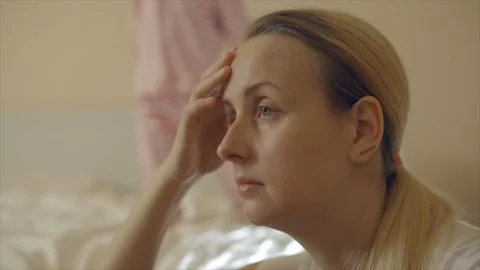 Tired mother of hyperactive child having headache Stock Footage 101722445