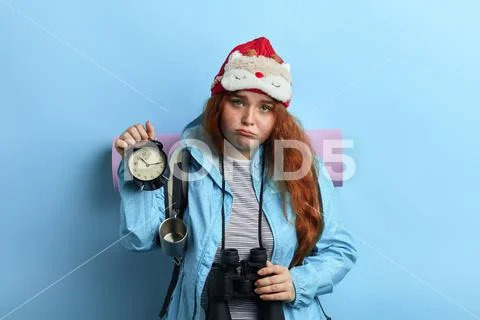 Tired nervour young woman isn't satisfied with holiday Stock Photos